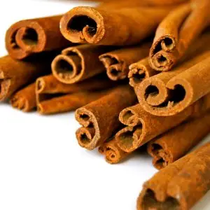 Aromatic cinnamon sticks displayed in a close-up view, capturing the texture and rich brown color.